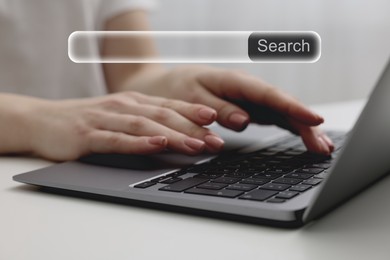 Search bar of website over laptop. Woman using computer at table, closeup