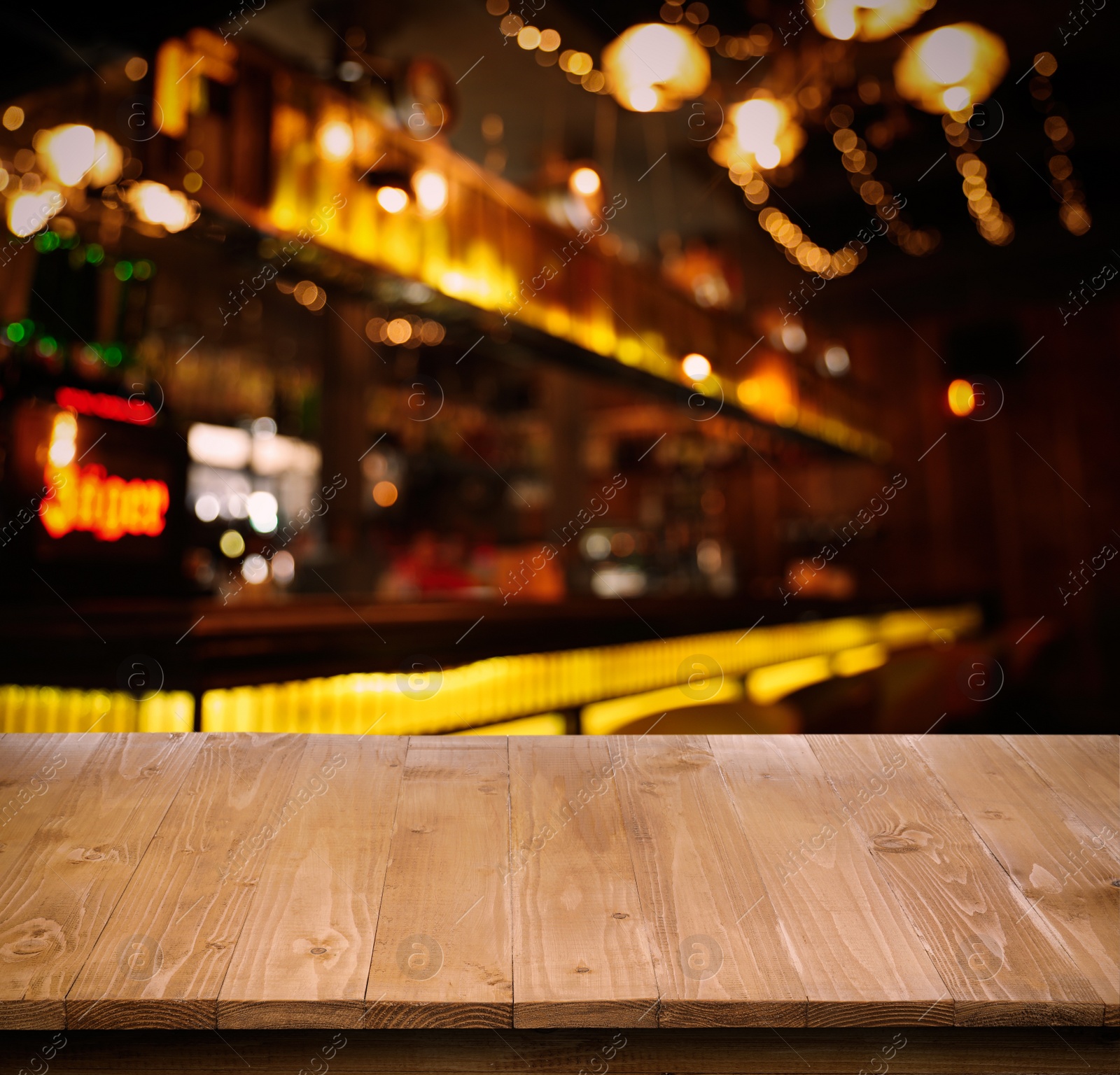 Image of Empty wooden surface and blurred view of bar interior. Space for design