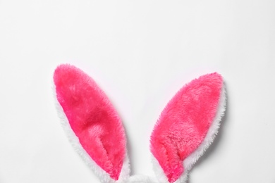 Photo of Funny Easter bunny ears on white background, top view