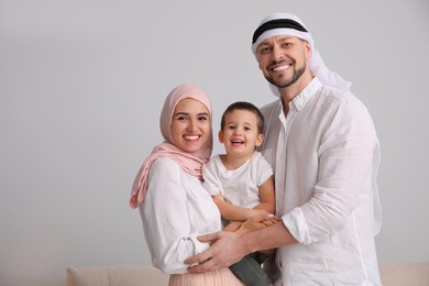 Photo of Happy Muslim family spending time together at home