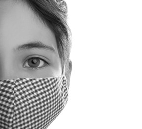 Image of Girl wearing medical face mask on light background, closeup. Black and white photography