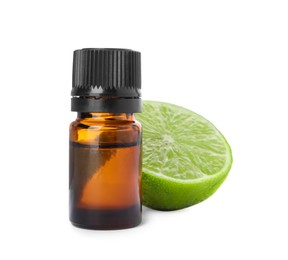 Photo of Bottle of citrus essential oil and cut fresh lime isolated on white