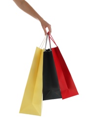 Woman with paper shopping bags on white background, closeup