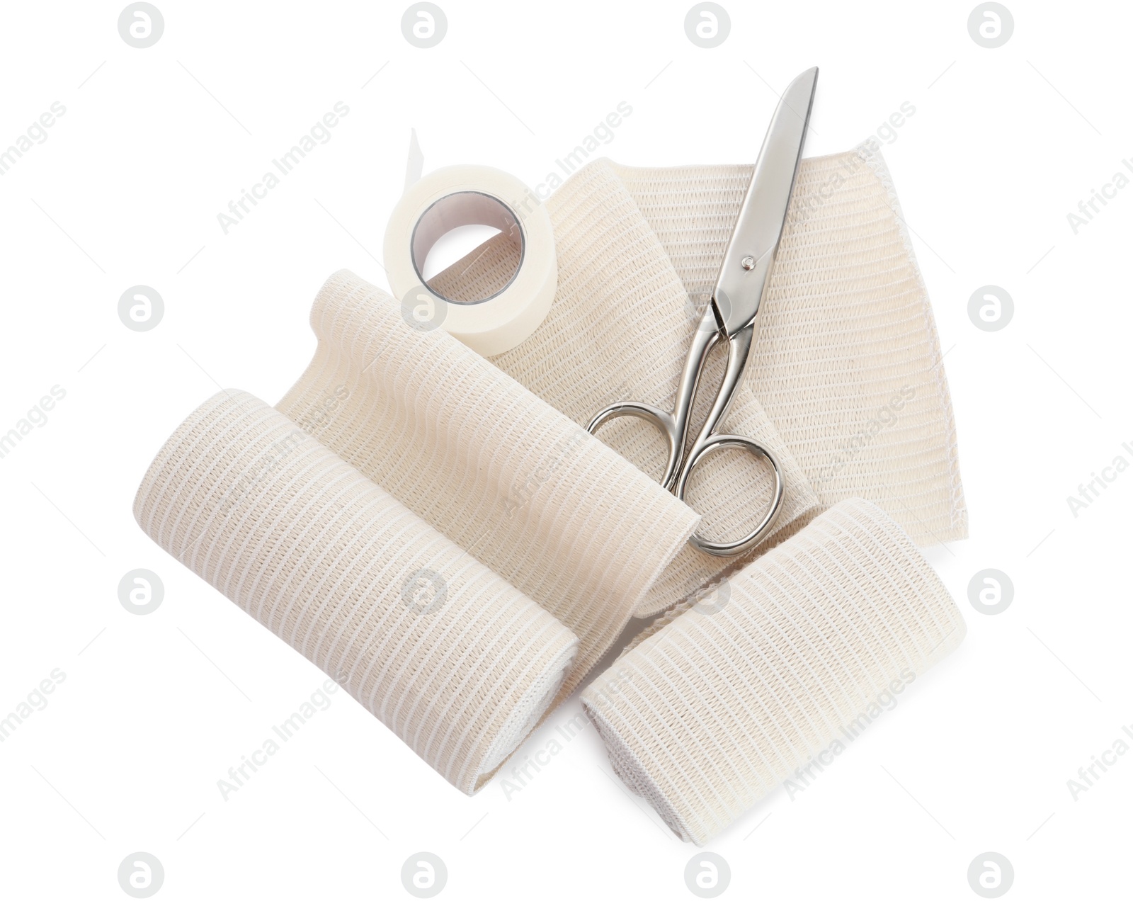 Photo of Medical bandage rolls, sticking plaster and scissors on white background, top view