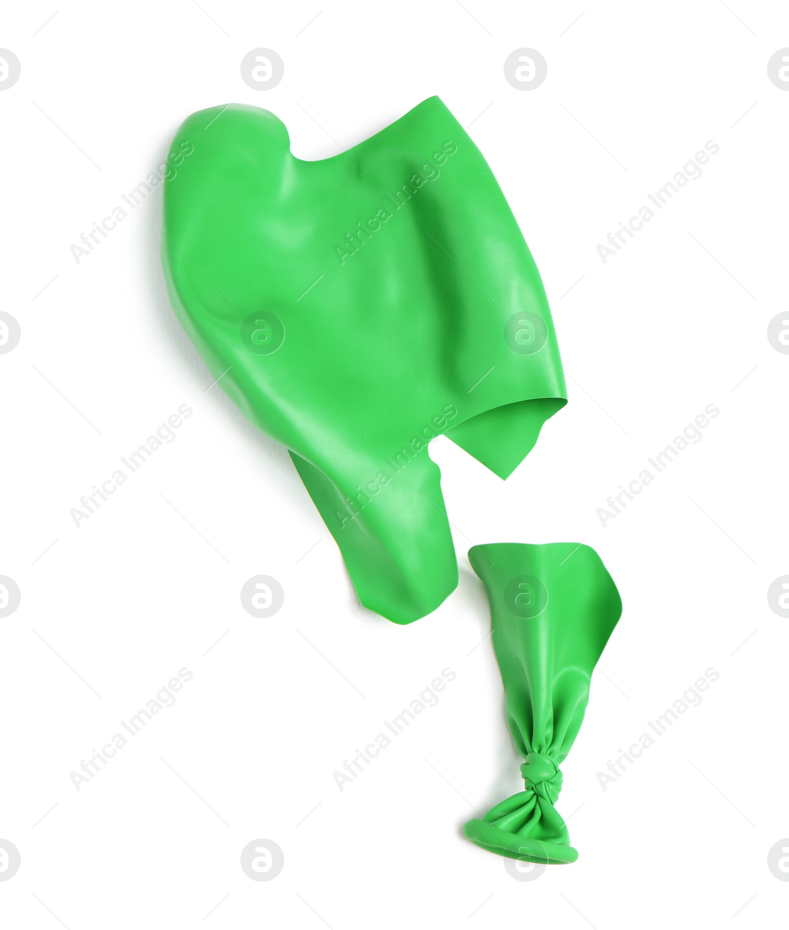 Photo of Popped color air balloon on white background, top view