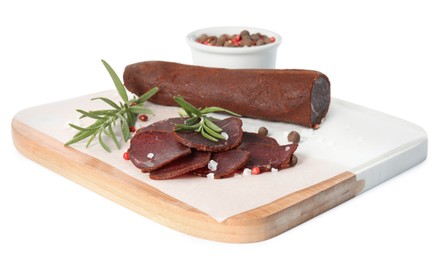 Photo of Delicious dry-cured beef basturma with rosemary and spices on white background