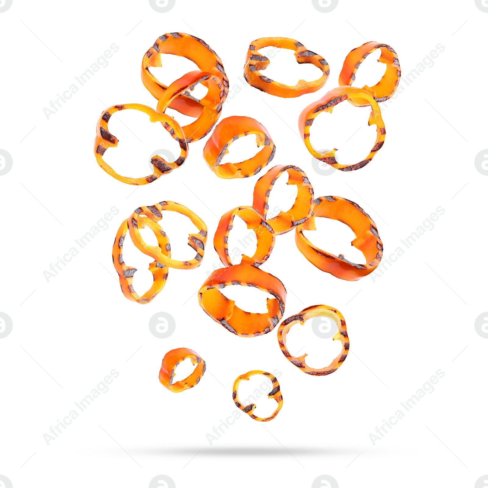 Image of Slices of grilled bell peppers in air on white background