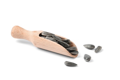 Photo of Raw organic sunflower seeds in wooden scoop isolated on white