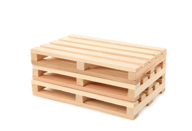 Photo of Stack of small wooden pallets on white background