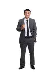 Businessman in suit with cup of drink on white background