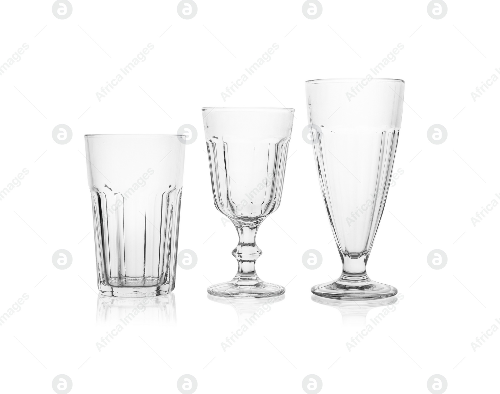 Photo of Set of empty glasses for different drinks on white background