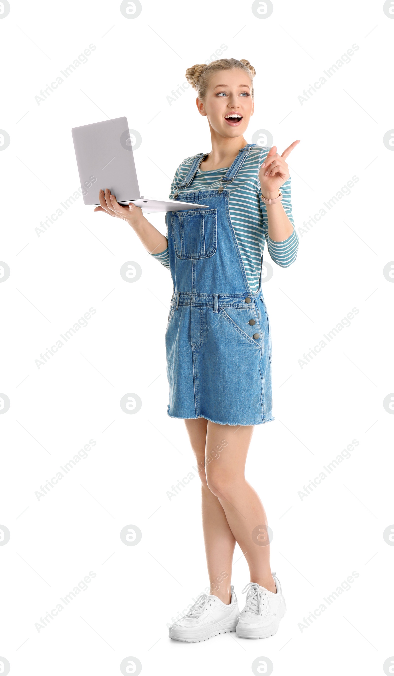 Photo of Full length portrait of emotional young woman with laptop isolated on white