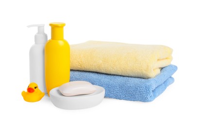 Baby cosmetic products, bath duck and towels isolated on white