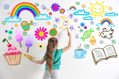 Image of Cute child girl drawing of colorful dye many different picture on white wall