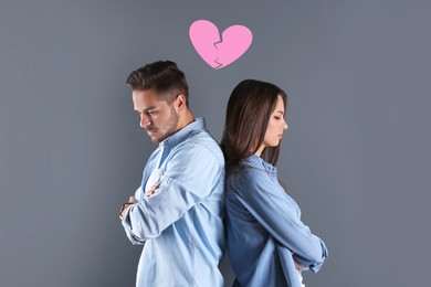 Image of Upset young couple and illustration of broken heart on grey background. Relationship problems