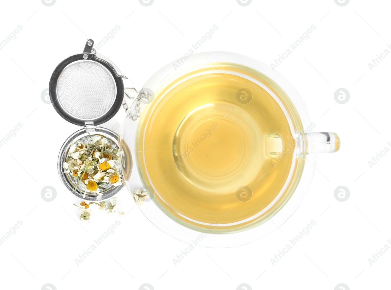 Photo of Fresh chamomile tea and dry flowers in infuser isolated on white, top view