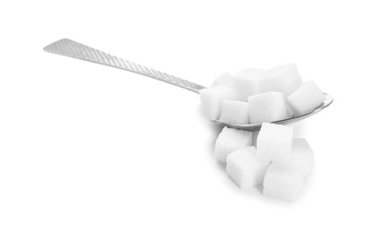 Sugar cubes and metal spoon isolated on white