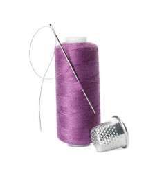 Photo of Spool of thread and sewing tools on white background