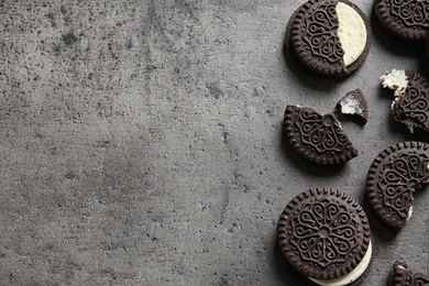 Photo of Tasty chocolate cookies on grey background, flat lay with space for text