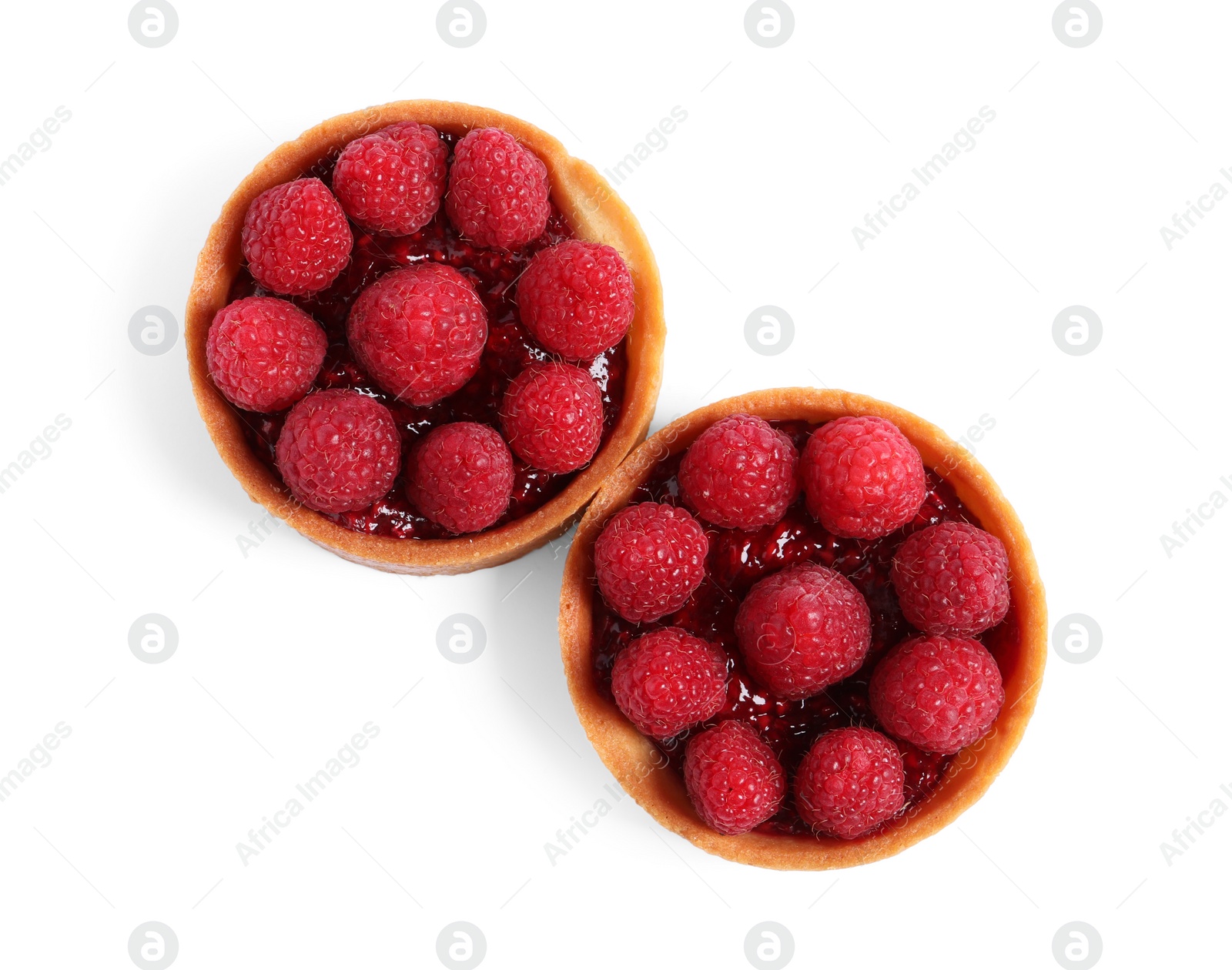 Photo of Tartlets with fresh raspberries isolated on white, top view. Delicious dessert