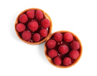 Photo of Tartlets with fresh raspberries isolated on white, top view. Delicious dessert