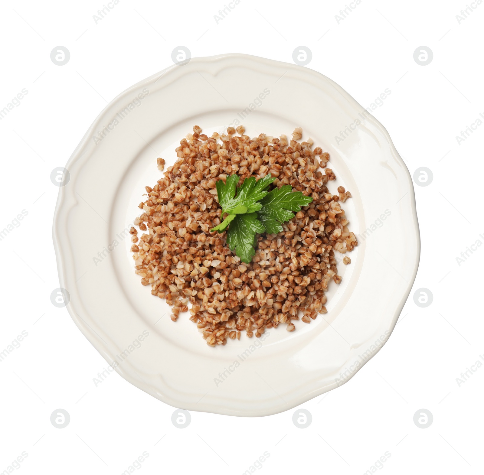 Photo of Plate with tasty buckwheat and fresh parsley isolated on white, top view