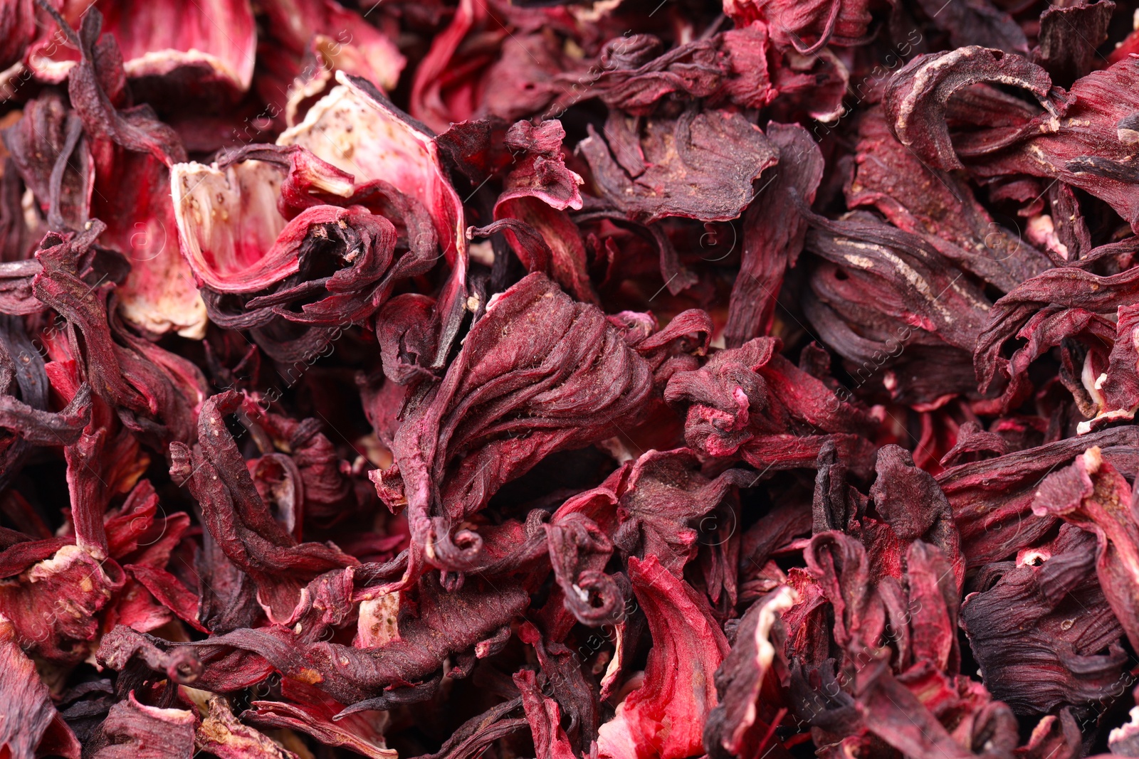 Photo of Dry hibiscus tea as background, closeup view