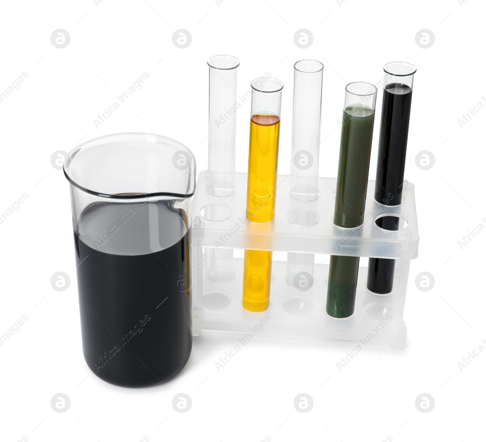 Photo of Beaker and test tubes with different types of oil isolated on white