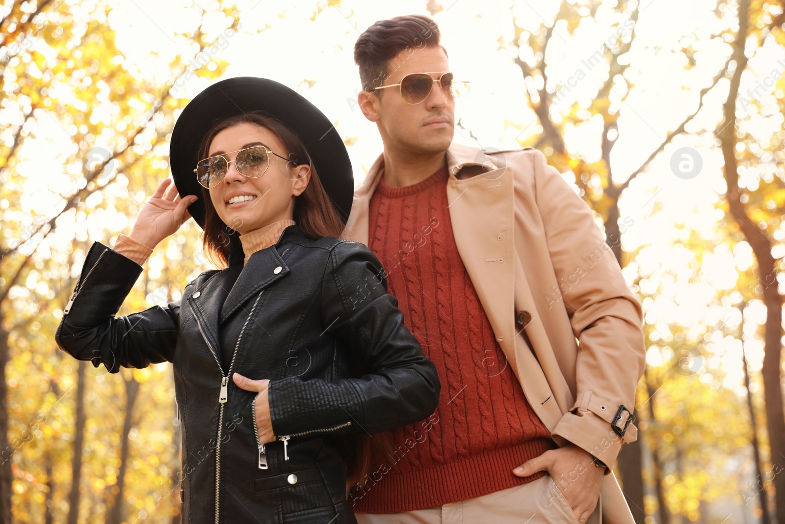 Photo of Lovely couple walking in park on autumn day