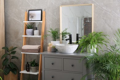 Photo of Modern bathroom interior with stylish vessel sink and beautiful green houseplants