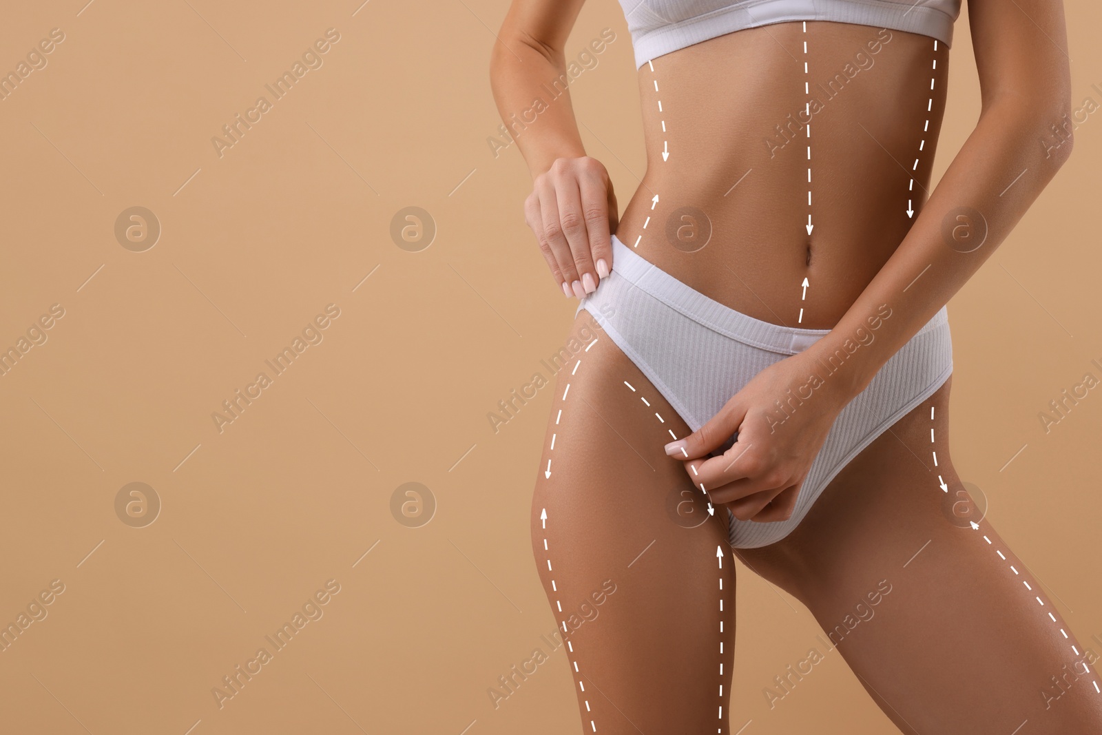 Image of Woman showing her beautiful figure on dark beige background, closeup. Space for text. Cosmetic treatment lines on her body