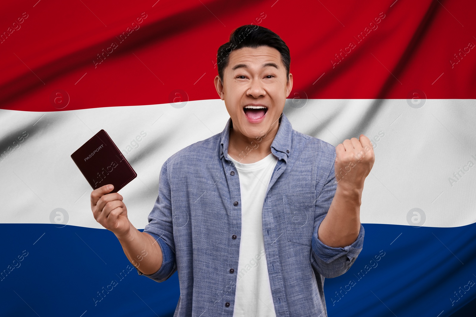 Image of Immigration. Happy man with passport against national flag of Netherlands
