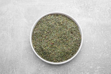 Photo of Plate with dried thyme on grey table, top view