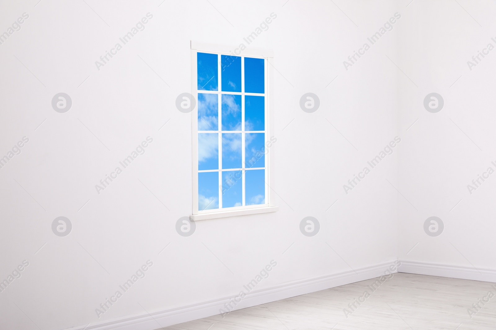 Image of Beautiful view on blue sky with clouds through window in room