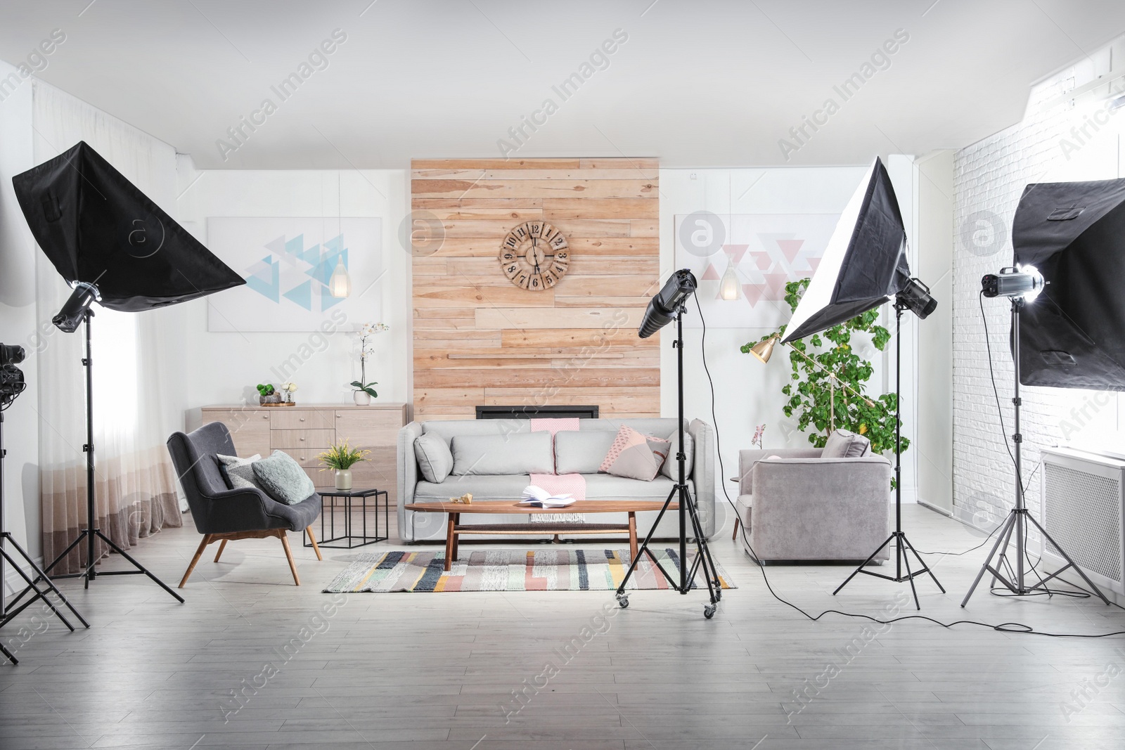 Photo of Professional photo studio equipment prepared for shooting living room interior