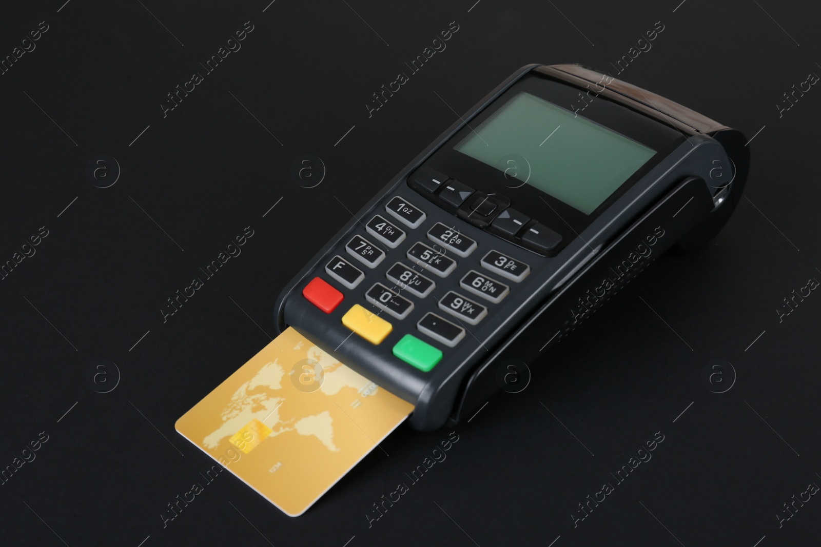 Photo of New modern payment terminal with credit card on black background