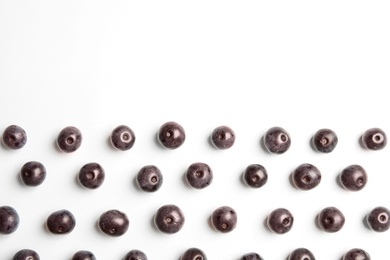 Photo of Fresh acai berries on white background