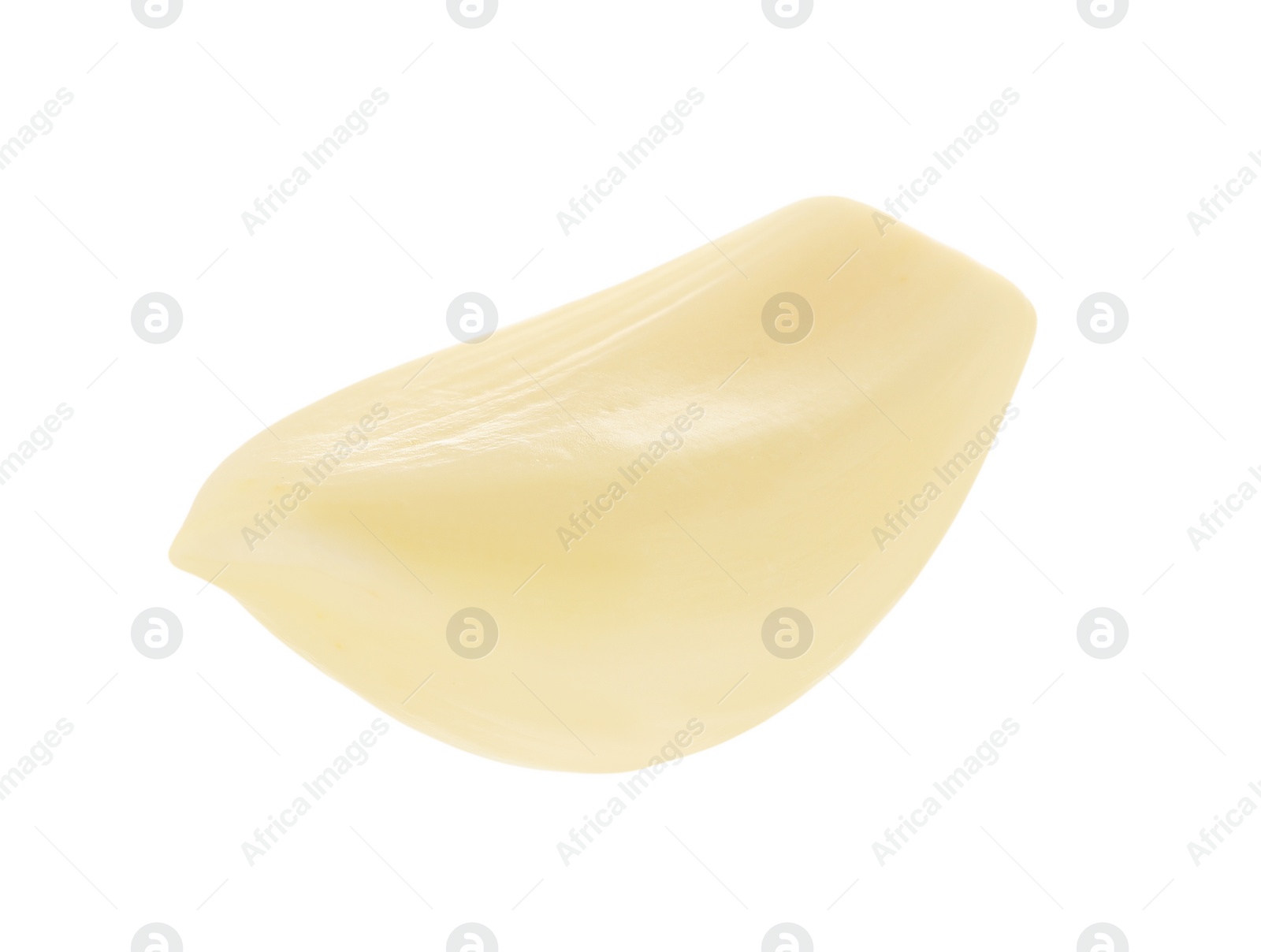 Photo of One peeled clove of garlic isolated on white