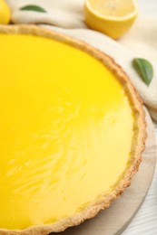 Photo of Delicious homemade lemon pie on table, closeup
