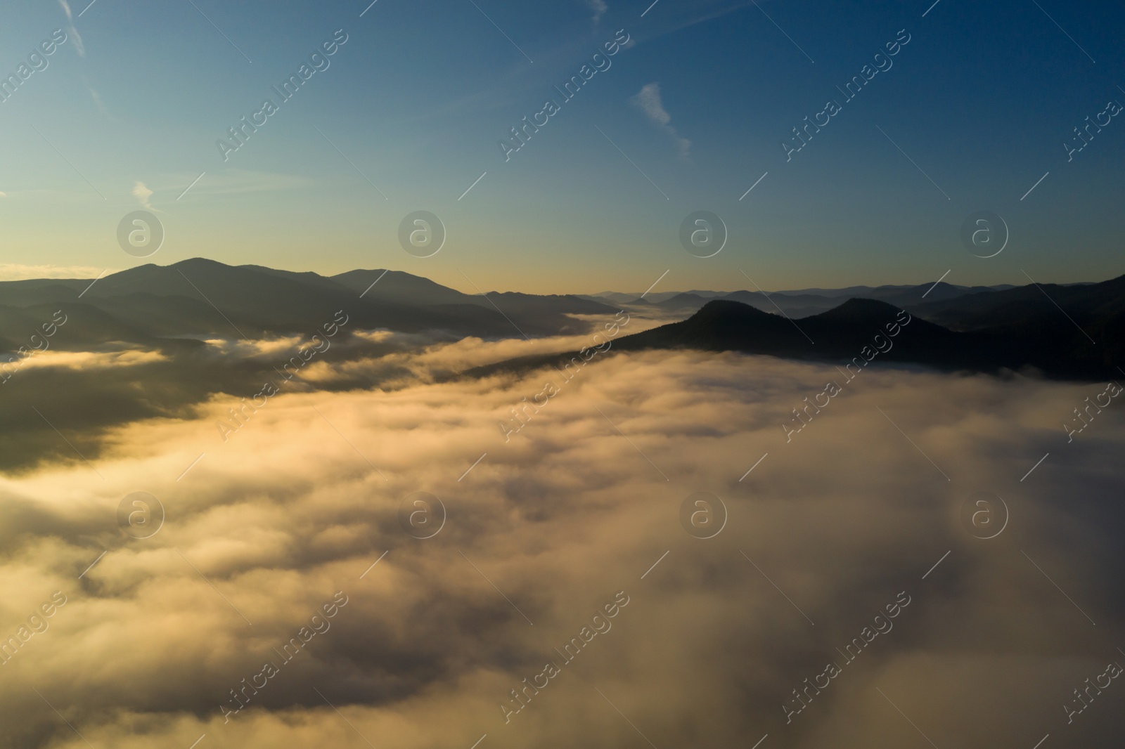 Image of  Beautiful landscape with thick mist in mountains. Drone photography