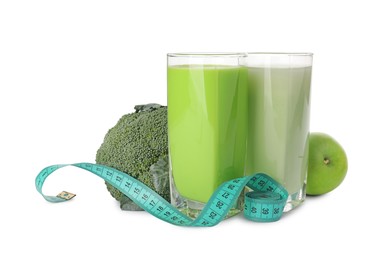 Tasty shakes, broccoli, apple and measuring tape isolated on white. Weight loss