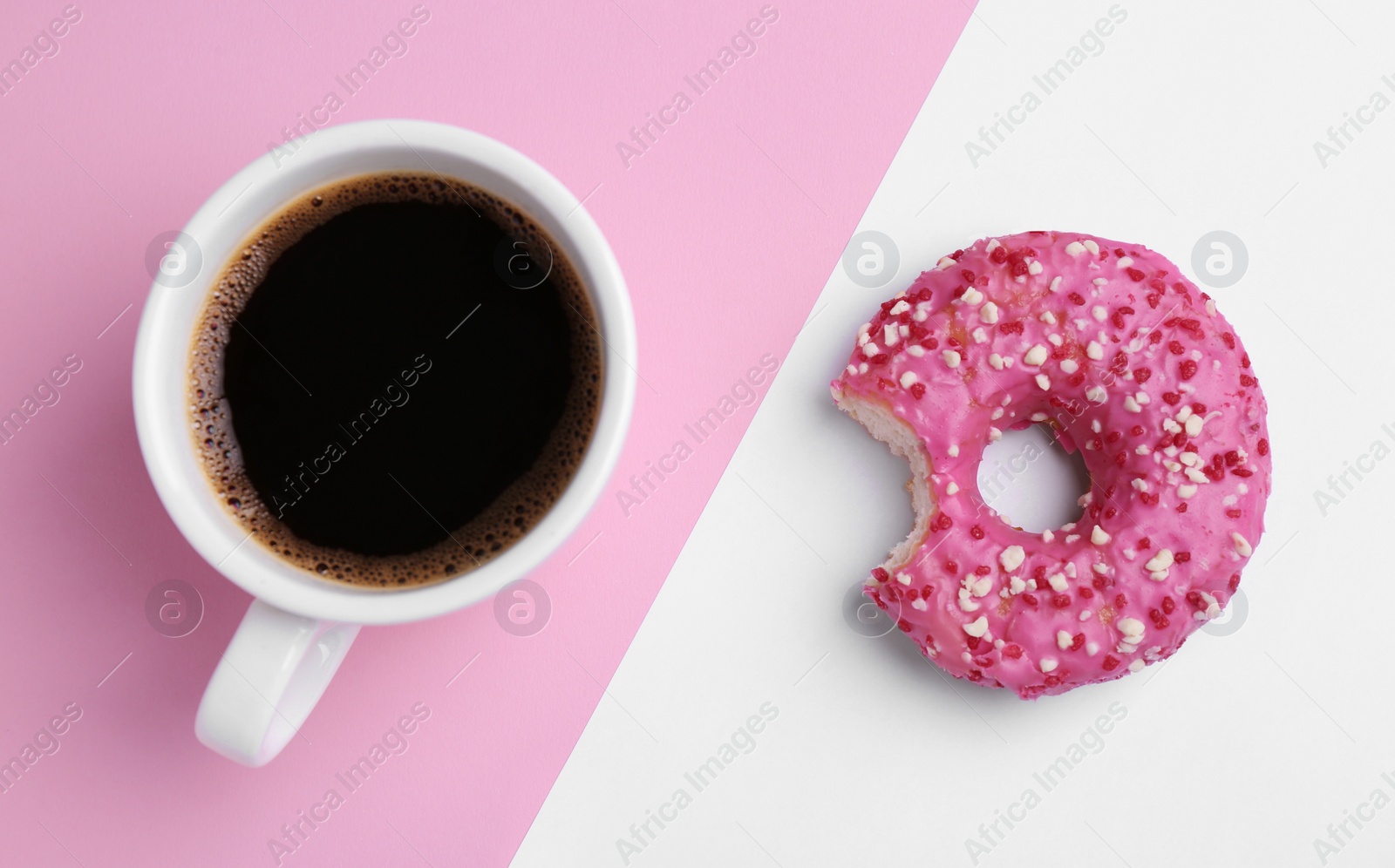 Photo of Tasty donut and cup of coffee on color background, flat lay