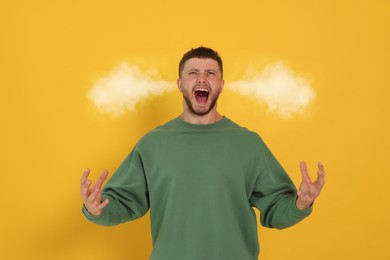 Image of Aggressive man with steam coming out of his ears on yellow background