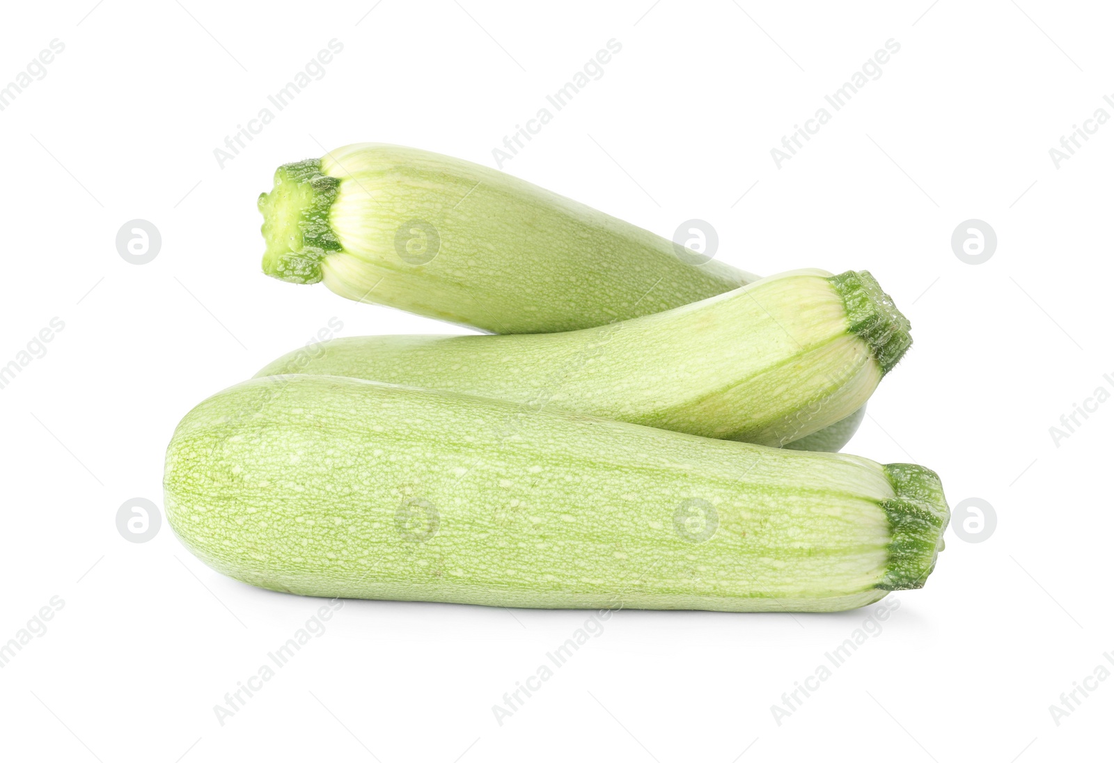 Photo of Raw green ripe zucchinis isolated on white