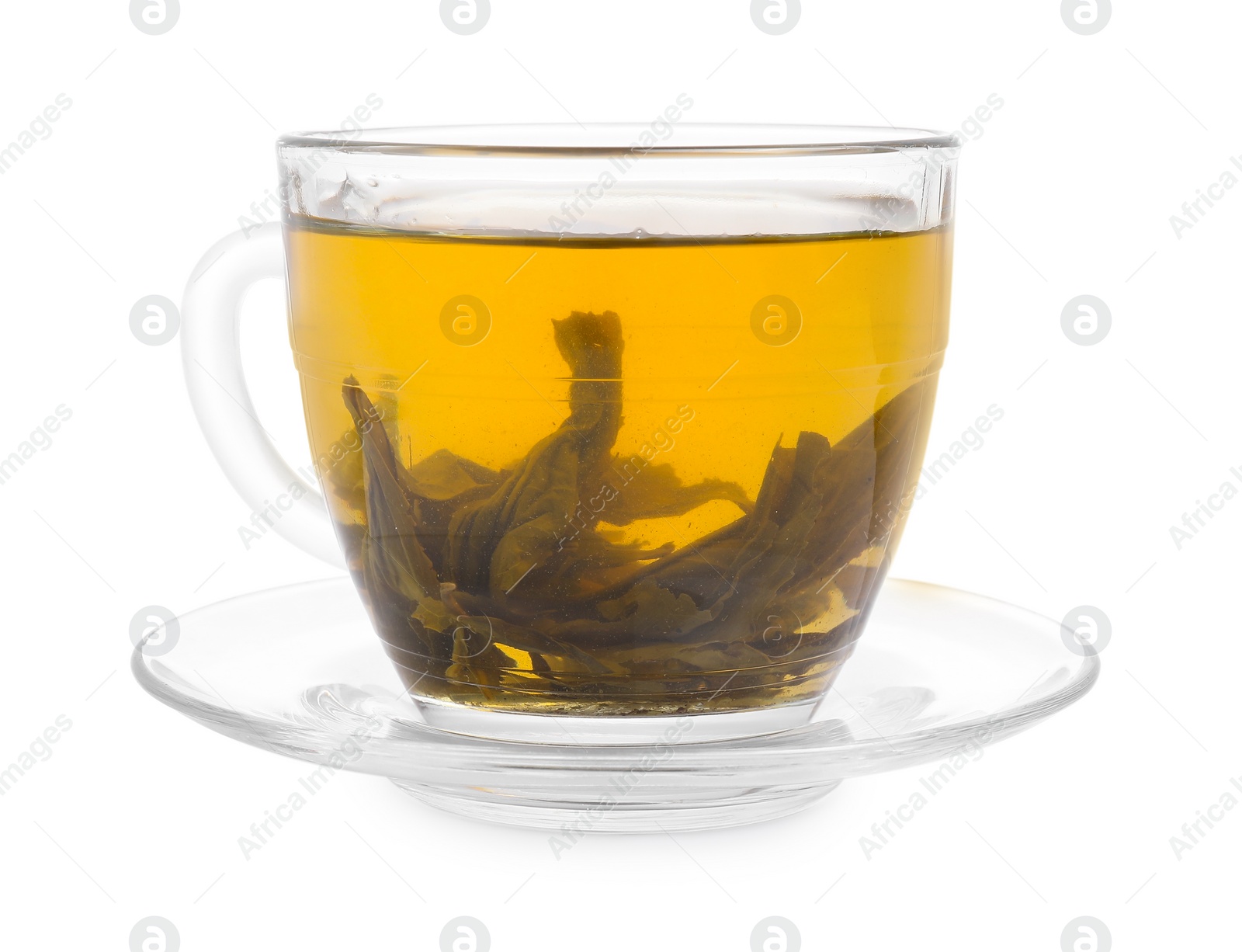 Photo of Fresh green tea in glass cup, leaves and saucer isolated on white