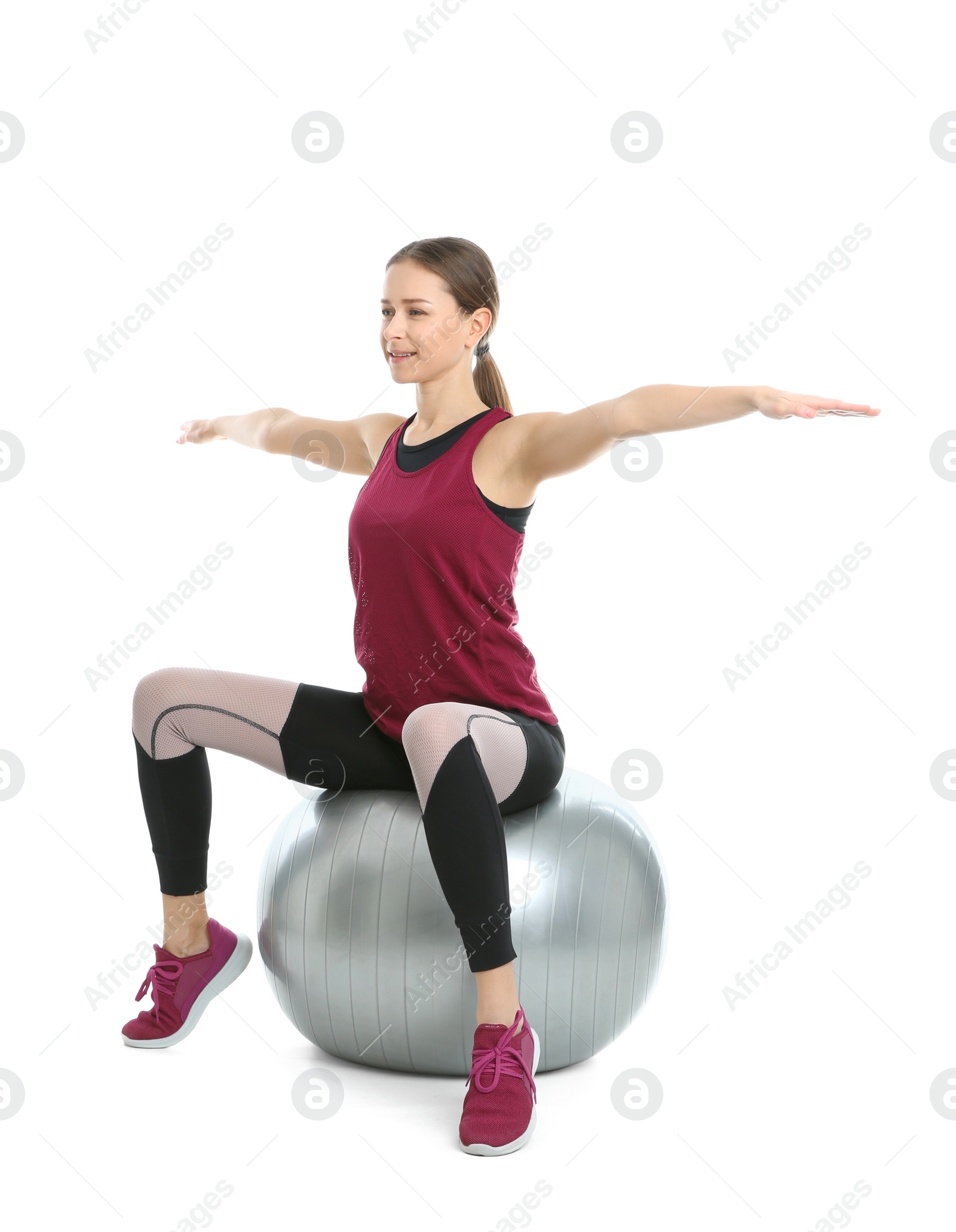 Photo of Young woman doing sports exercises isolated on white. Home fitness