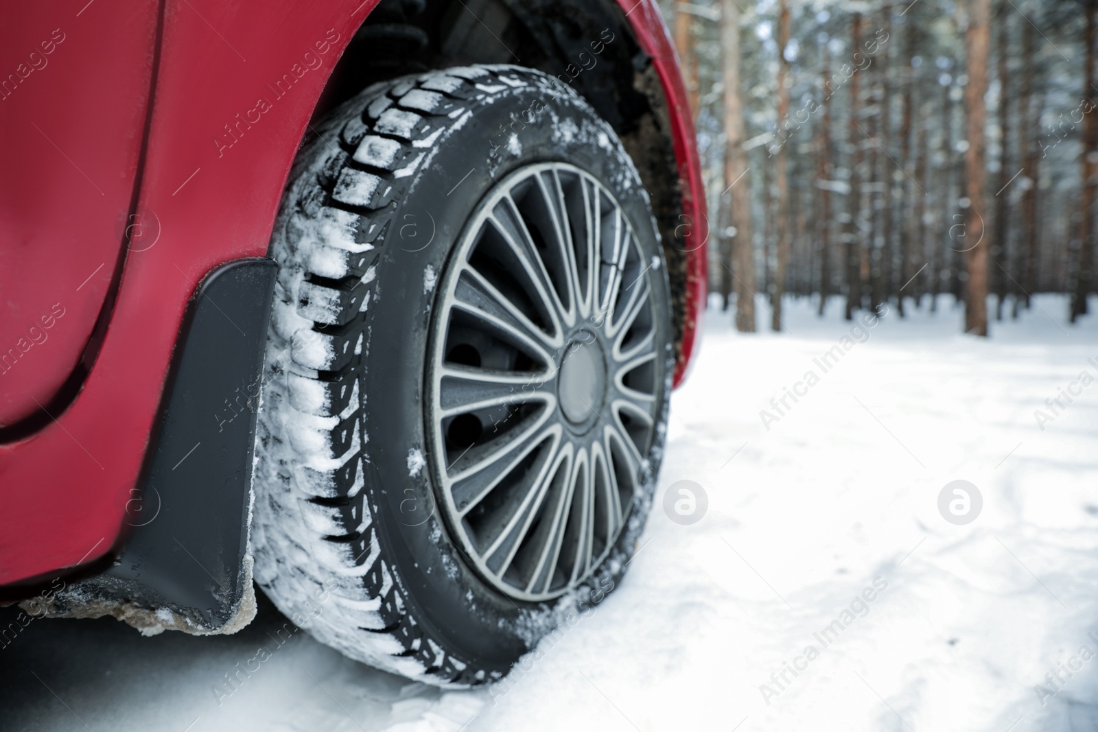 Photo of Car on snowy road, closeup. Space for text