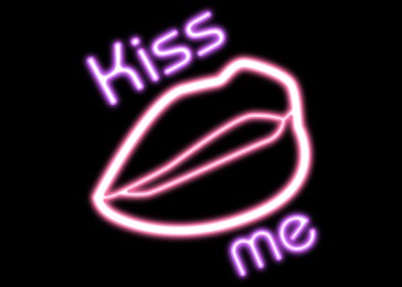 Glowing neon sign with lips and words Kiss Me on black background