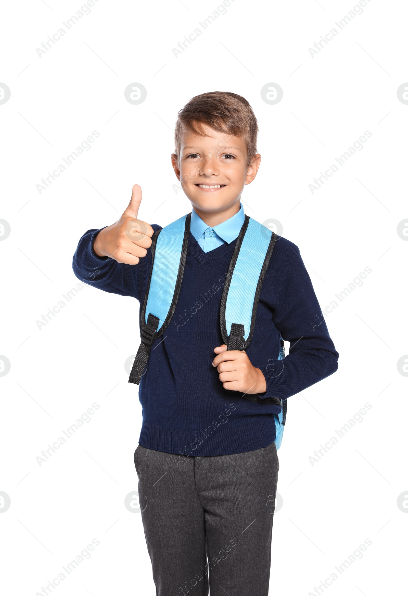 Photo of Little boy in stylish school uniform on white background