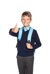 Little boy in stylish school uniform on white background